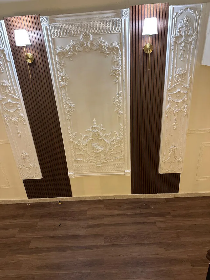 Plaster and walnut on a landing wall